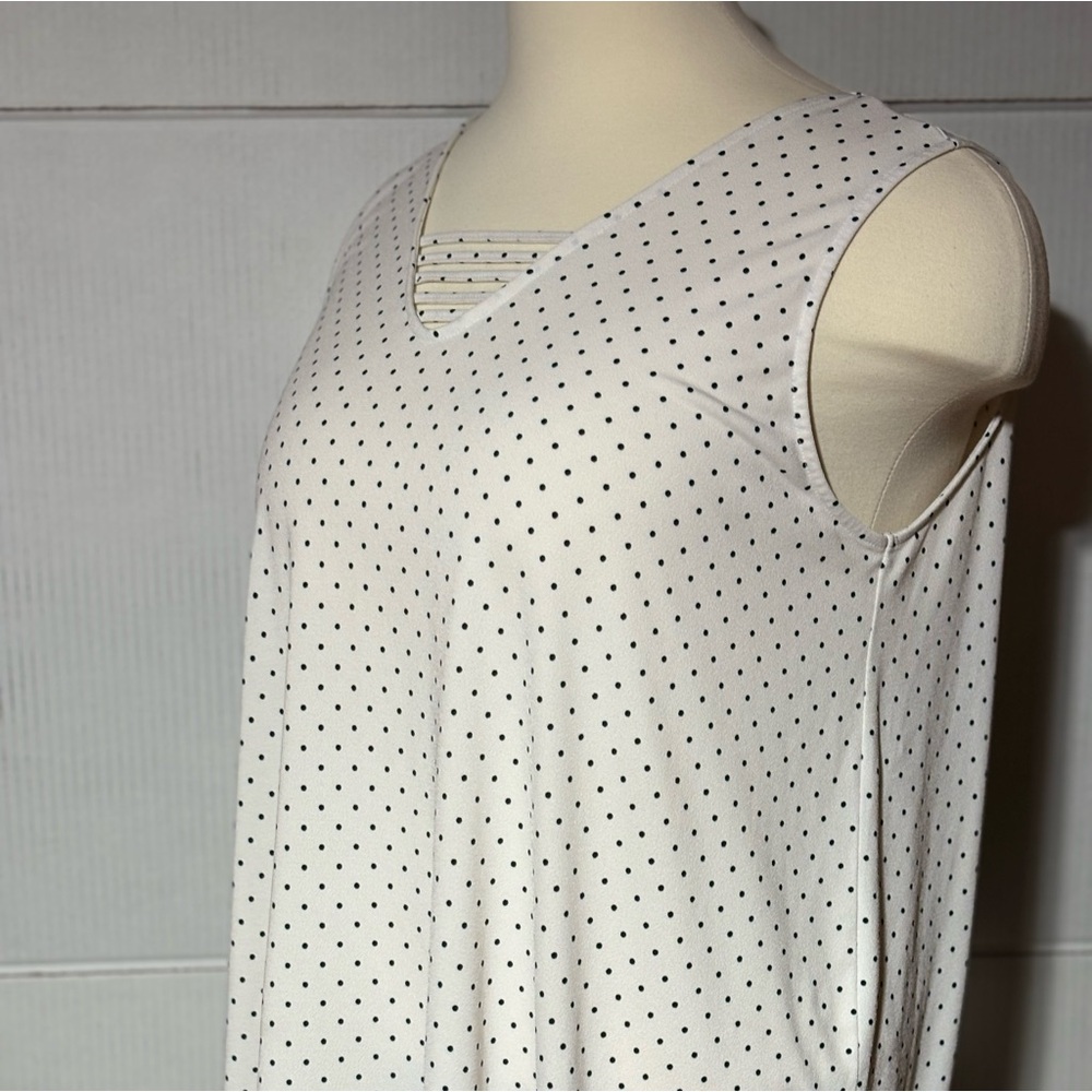 In every step 3X white/black polka dot tank. Wear under a black cardigan.